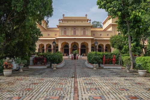 a large building with a courtyard in front of it at Hotel Narain Niwas Palace in Jaipur