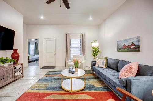 a living room with a couch and a table at Luxury Lubbock Home Retreat near Texas Tech in Lubbock