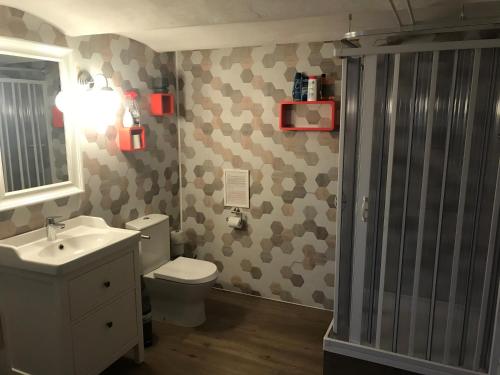 a bathroom with a toilet and a sink at Ferienwohnung Westerburg in Westerburg