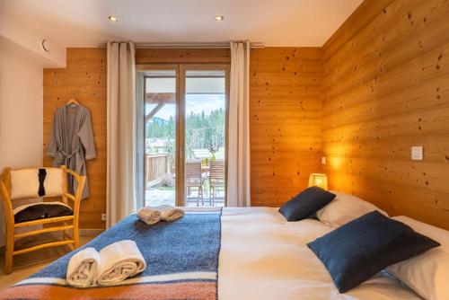 Posteľ alebo postele v izbe v ubytovaní Chalet le 4 - numéro 4