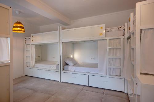 a room with two bunk beds in it at Sun Lovers Hostel in Albufeira
