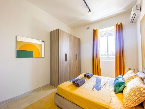 a bedroom with a bed and a window at First floor 2 bedroom Modern Apartment in Gzira 3 in Il-Gżira
