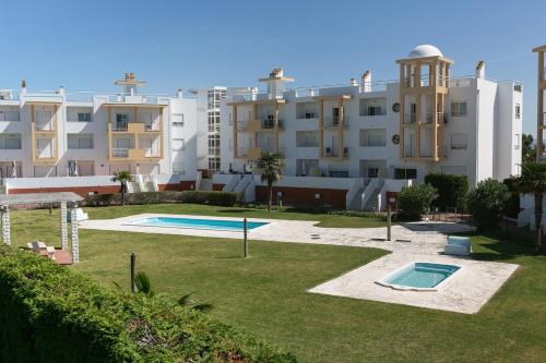 a view of an apartment complex with a swimming pool at Green Hill in Nazaré