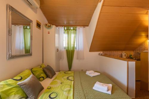 a small room with a bed and a window at Central Old Town Apartments in Dubrovnik