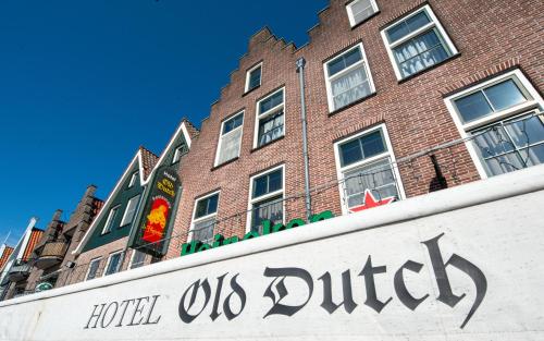 a hotel us district sign in front of a building at Hotel Old Dutch in Volendam