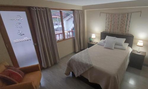 a hotel room with a bed and a window at La Casa de la Abuela I in Yucay