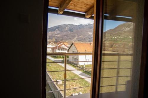 a window with a view of a mountain at SARAH APARTMENTS in Gusinje