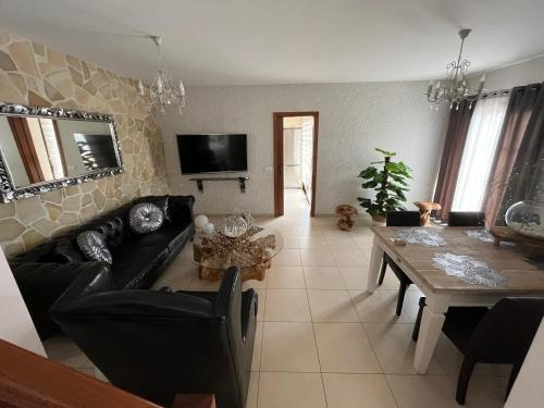 a living room with a couch and a table at Casa Mararía in Gran Tarajal