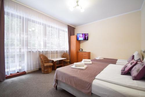 Postel nebo postele na pokoji v ubytování Willa Paweł z balią i jacuzzi