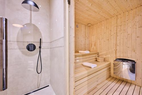a sauna with a shower and a toilet in it at Winery Cuj Bed & Breakfast in Vilanija