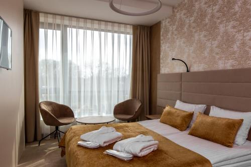 Postel nebo postele na pokoji v ubytování Grand SPA Lietuva Hotel Lietuva