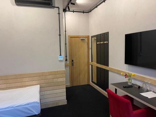 Televiisor ja/või meelelahutuskeskus majutusasutuses Art Hotel 158