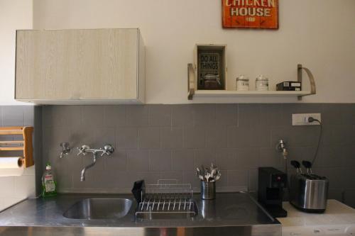a kitchen counter with a sink and a sink at Apartment Flaminio in Rome