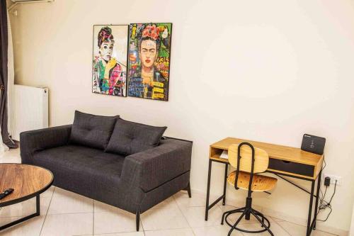 a living room with a couch and a table at Lavrio Olympic Marine Seaview 2bdr Apt in Lávrion