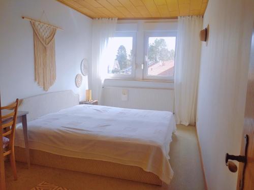 Ένα ή περισσότερα κρεβάτια σε δωμάτιο στο Urlaub nähe Badesee und Strand