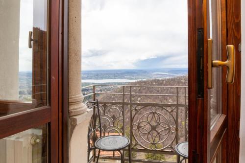 an open door to a balcony with a view at Albergo Sacro Monte Varese in Varese
