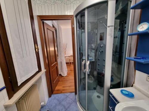 a bathroom with a shower and a sink and a toilet at B&B Accanto al Focolare in Udine