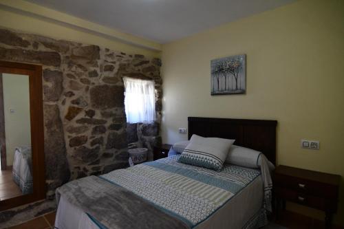 Letto o letti in una camera di Casa Avoa María