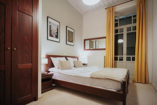 a bedroom with a bed and a window at 1909 Guesthouse in Kalavrita
