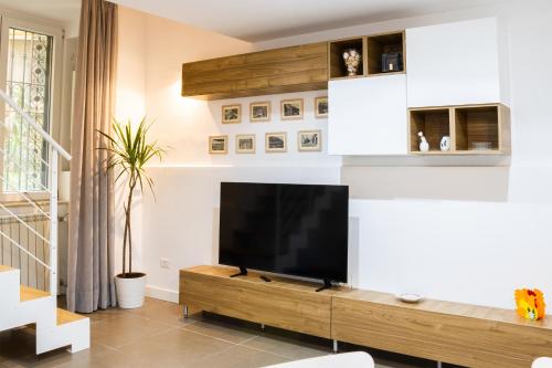 a living room with a flat screen tv at La Casa del Duca in Naples