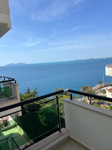 a balcony with a view of the ocean at The Blue Horizon in Vlorë