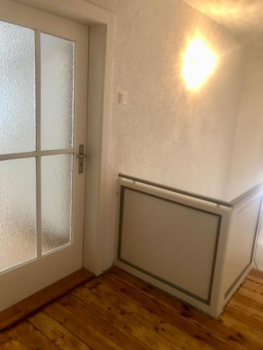 an empty room with a door and a window at Villa Rosa in Bad Rodach