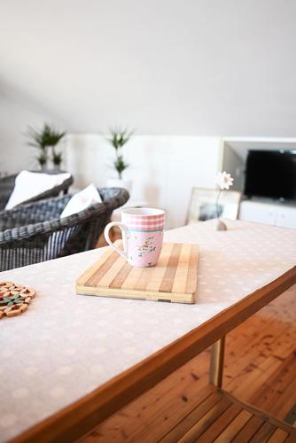 a coffee cup sitting on top of a table at Tanya-Apartments and Rooms in Hvar