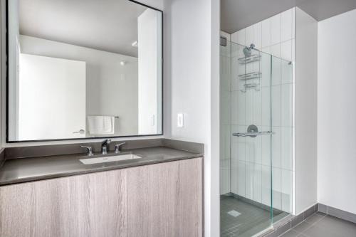 a bathroom with a sink and a shower at S Loop 1BR w Pool Gym Spa nr Grant Park CHI-742 in Chicago