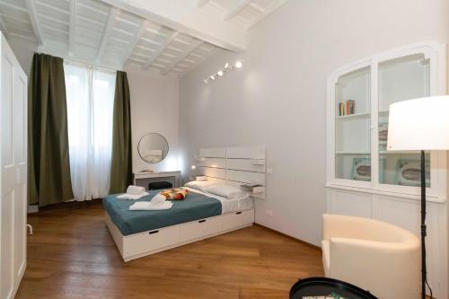 a small bedroom with a bed and a mirror at La Mole Central & Comfy Apartment in Turin