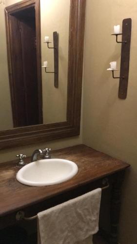 a bathroom with a sink and a mirror at Quinta El Monte in Tandil