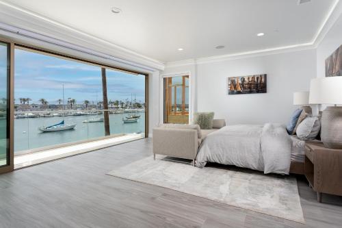 a bedroom with a bed and a large window at 367 Via Lido Soud in Newport Beach