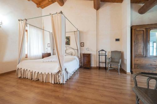 Postel nebo postele na pokoji v ubytování Fenil Conter Cottage & Suite