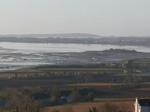 a view of a body of water with a river at Converted cattle barn overlooking Strangford Lough in Newtownards
