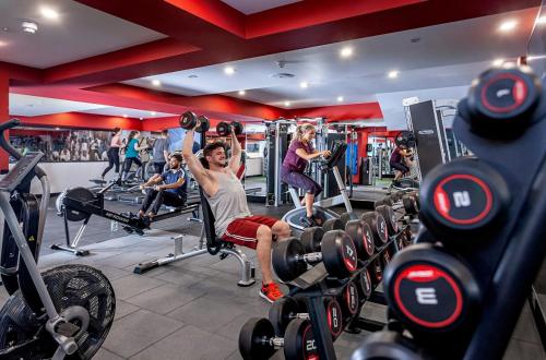 a man is sitting on a bench in a gym at Brotherton House in Leeds in Leeds
