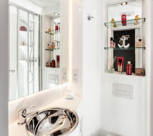 a bathroom with a sink and a mirror at Brotherton House in Leeds in Leeds