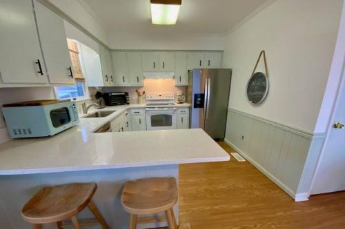 a kitchen with white cabinets and a white counter top at 47 Oyster Bay Dr in Fenwick Island