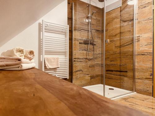 a large bathroom with a shower and a tub at Zum Alten Krug in Naumburg