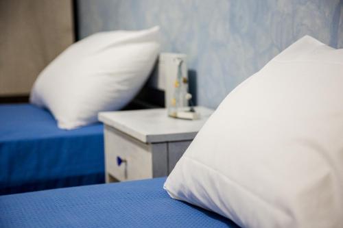 Ένα ή περισσότερα κρεβάτια σε δωμάτιο στο Vassos Apartments