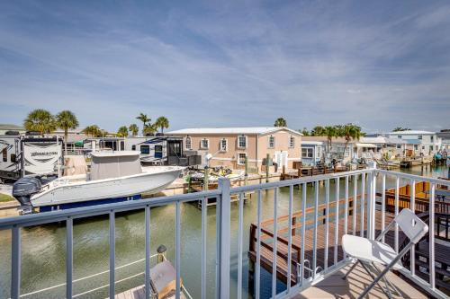 a boat is docked at a marina at Nettles Island, Jensen Beach Home with Patio and Grill in Jensen Beach