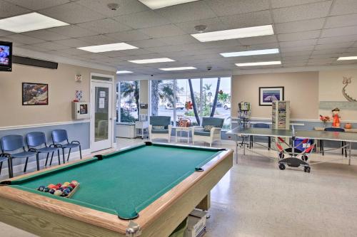 a billiard room with a pool table and chairs at Nettles Island, Jensen Beach Home with Patio and Grill in Jensen Beach