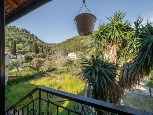 a balcony with a view of a mountain at Pandora's Corfu Apartments in Agios Gordios