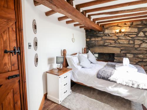 Säng eller sängar i ett rum på Ty'n-Y-Ffynnon Cottage
