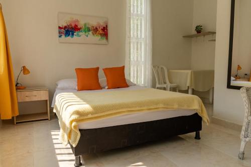 Postel nebo postele na pokoji v ubytování Casa El Limonar Garzón Hospedaje Campestre