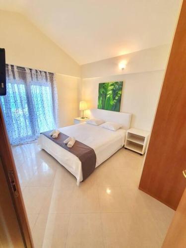 Postel nebo postele na pokoji v ubytování Seaside Getaway Kriopigi
