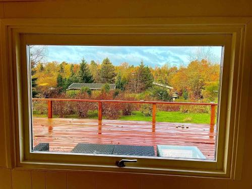 ventana con vistas a una terraza en Nice Holiday Home Near Tisvilde Town And Beach, en Vejby