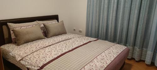 Ένα ή περισσότερα κρεβάτια σε δωμάτιο στο Apartman Stojanovic