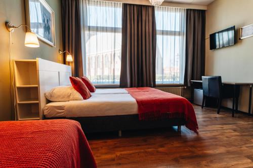 Ένα ή περισσότερα κρεβάτια σε δωμάτιο στο Hotel Renesse