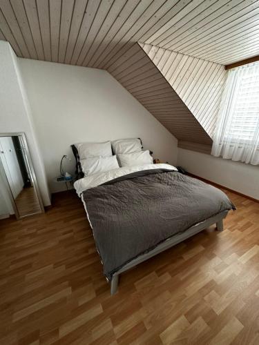 a bedroom with a large bed with a roof at Sunny private Apartment in an amazing valley in Wila
