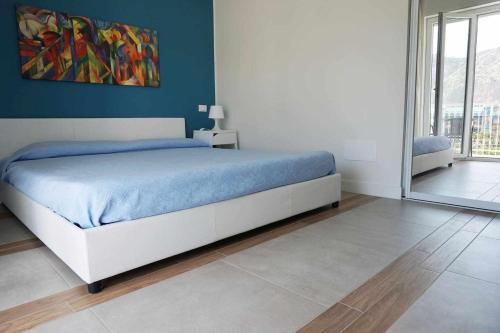 Postel nebo postele na pokoji v ubytování Favorita blue la tua suite a Palermo