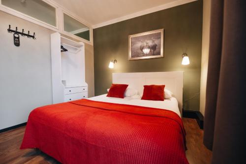 Ένα ή περισσότερα κρεβάτια σε δωμάτιο στο Hotel Renesse